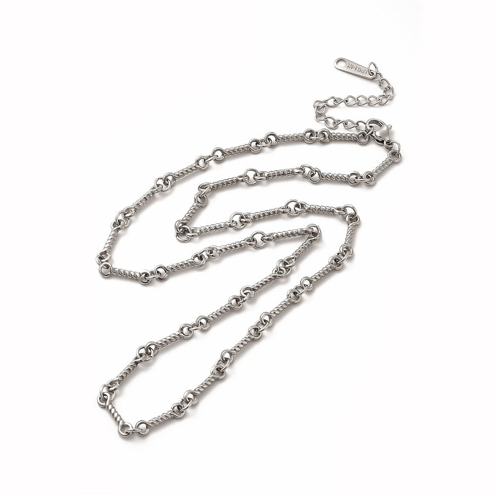 silver tone twisted bar link chain necklace with lobster claw clasp, extender chain over white background. 