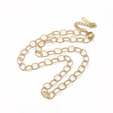 golden hammered oval link chain necklace with lobster claw clasp and extender chain over white background. 