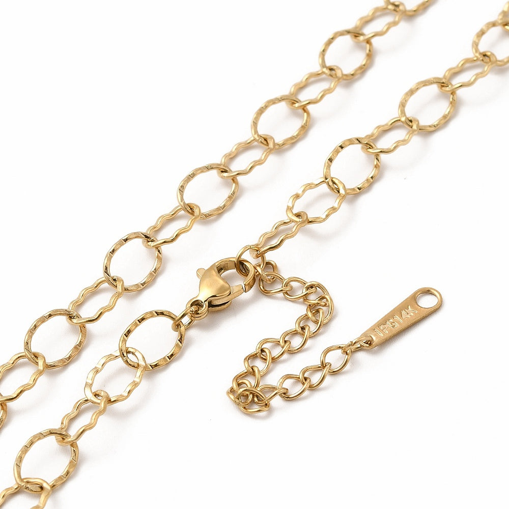 zoomed in sections of golden hammered oval link chain with lobster claw clasp and extender chain over white background. 