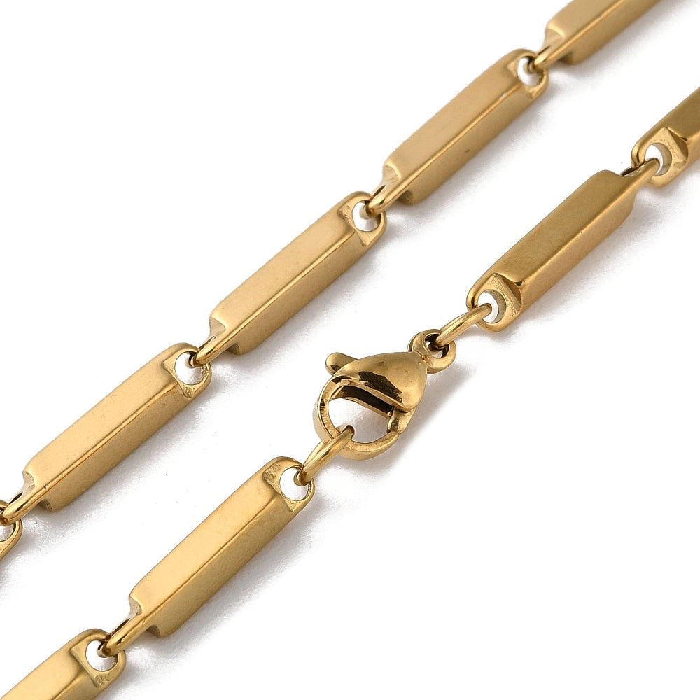 zoomed in sections of golden bar link chain necklace with lobster claw clasp over white background. 