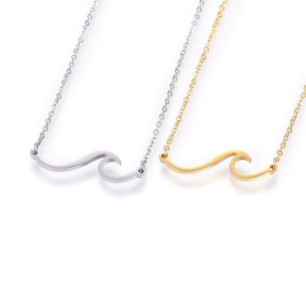 one silver tone and one golden wave pendant necklace on cable chain displayed side by side over a white background. 