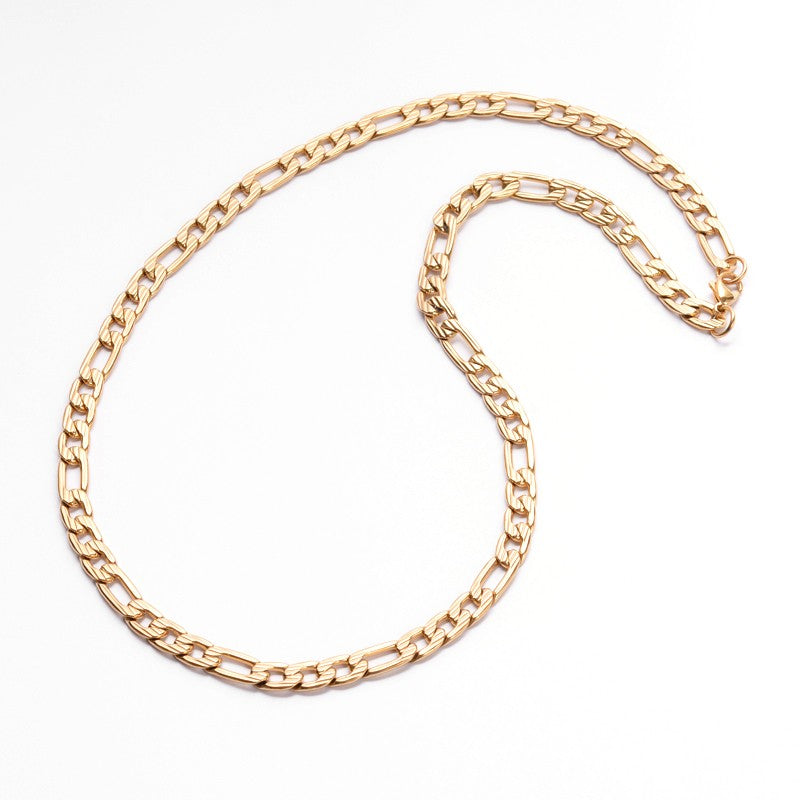 golden Figaro necklace with lobster claw clasp over white background.