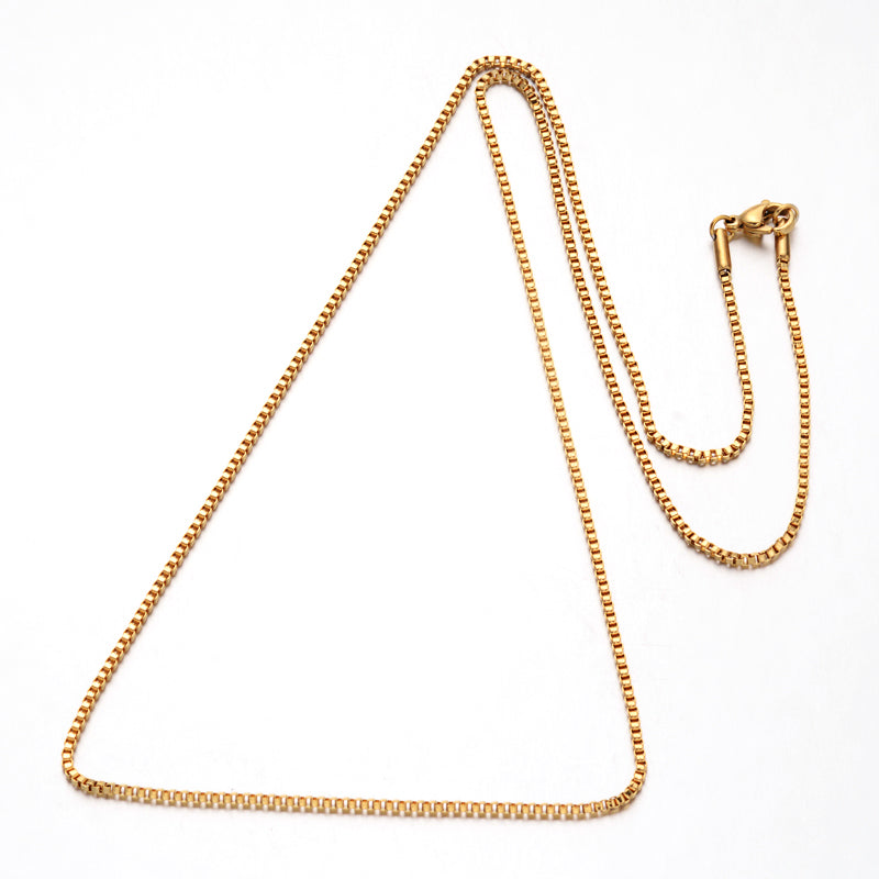golden box chain necklace with lobster claw clasp over white background. 