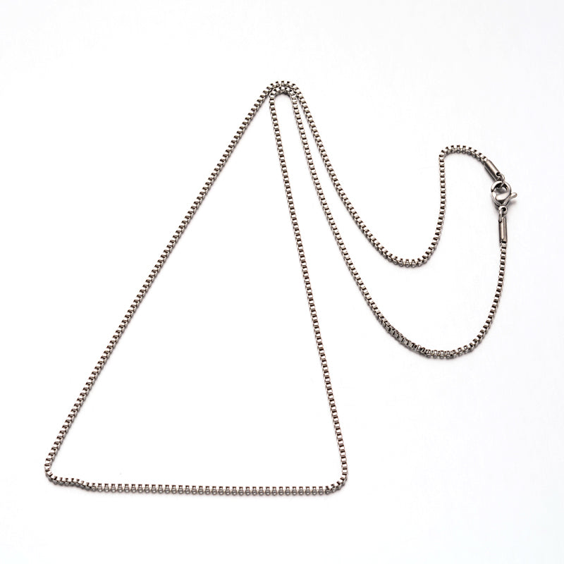 silver tone box chain necklace with lobster claw clasp over white background. 