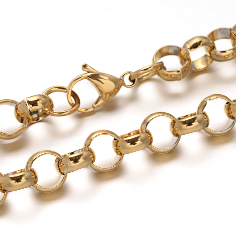 zoomed in sections of golden large link Rolo chain with lobster claw clasp on white background. 
