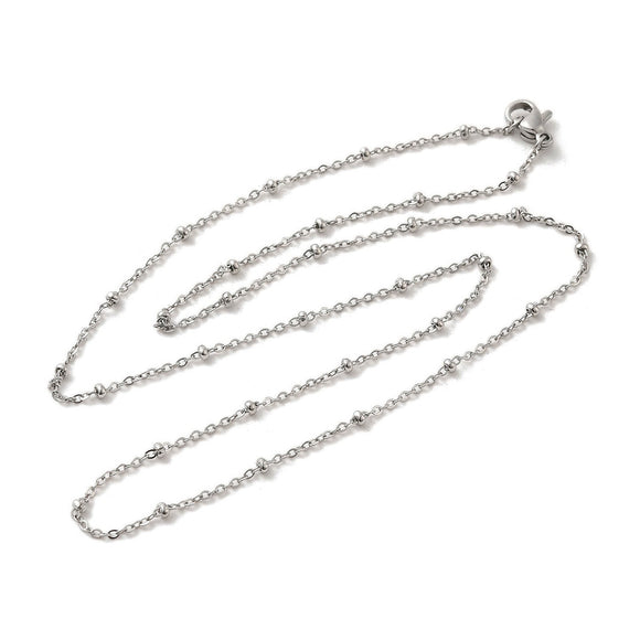 silver tone satellite chain necklace with rondelle beads and lobster claw clasp over white background. 