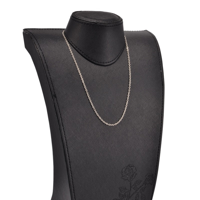 silver tone cable chain displayed on black neck form against white background. 