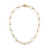 golden safety pin link chain necklace with toggle clasp over white background. 