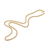 golden small curb chain with lobster claw clasp over white background. 