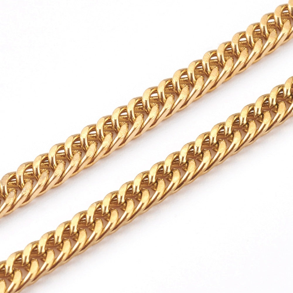 zoomed in sections of golden small  curb link chain over white background. 