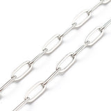 zoomed in sections of silver tone paperclip chain necklace over white background. 