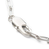 zoomed in section of silver tone lobster claw clasp on paperclip chain over white background. 