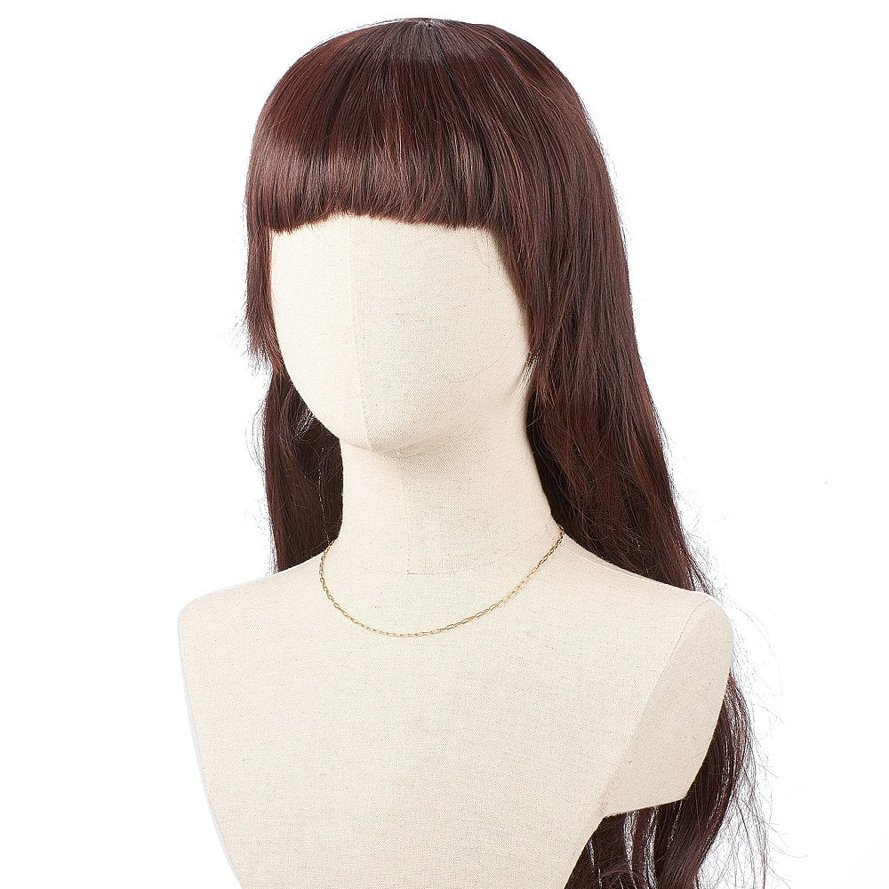 small golden paperclip chain necklace on burlap mannequin with long burgundy hair against white background. 