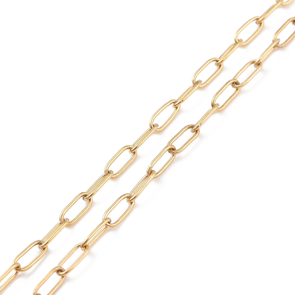zoomed in sections of small golden paperclip chain over white background. 