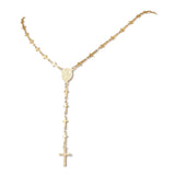 golden rosary style necklace featuring a traditional Virgin Mary connector and cross pendant while the links are made up of small crosses over a white background. 