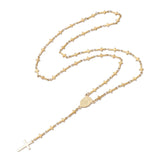golden rosary style necklace featuring a traditional Virgin Mary connector and cross pendant while the links are made up of small crosses over a white background. 