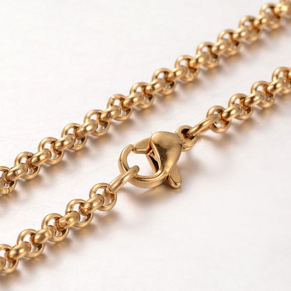 zoomed in section so golden Rolo chain necklace with lobster claw clasp on white background. 