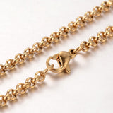 zoomed in section so golden Rolo chain necklace with lobster claw clasp on white background. 
