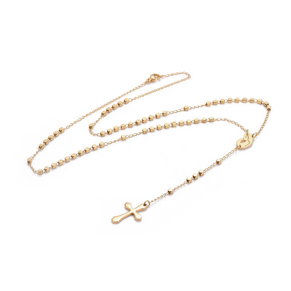 golden rosary necklace with cube rosary beads a profile of Virgin Mary connector a cross pendant with a lobster claw clasp over white background. 