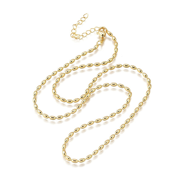 golden oval ball chain necklace with lobster claw clasp and extender chain over white background. 