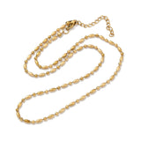 golden oval and round link ball chain necklace with lobster claw clasp and extender chain over white background. 