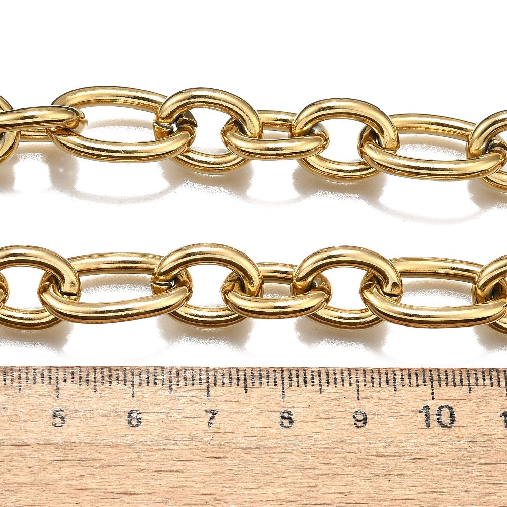 golden, large alternating oval and round link chain displayed above wooden ruler  on white background. 
