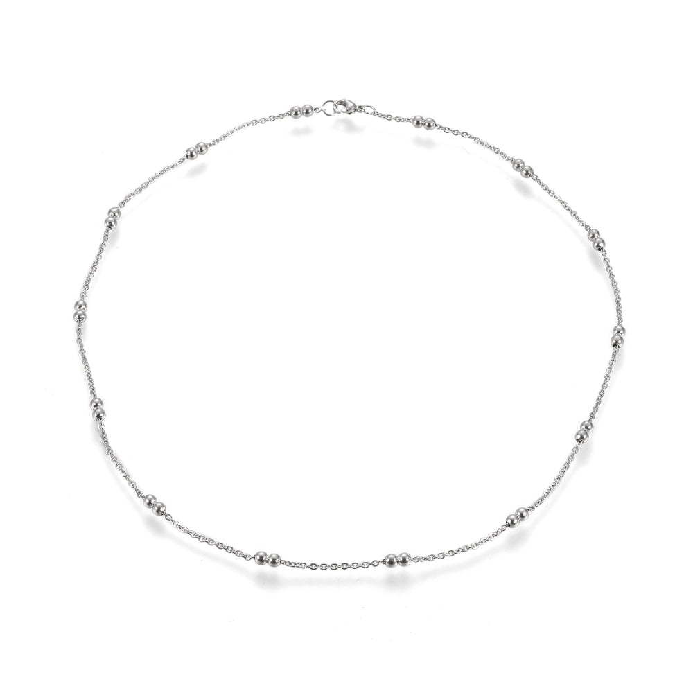 silver tone cable link double satellite chain necklace with lobster claw clasp on a white background. 