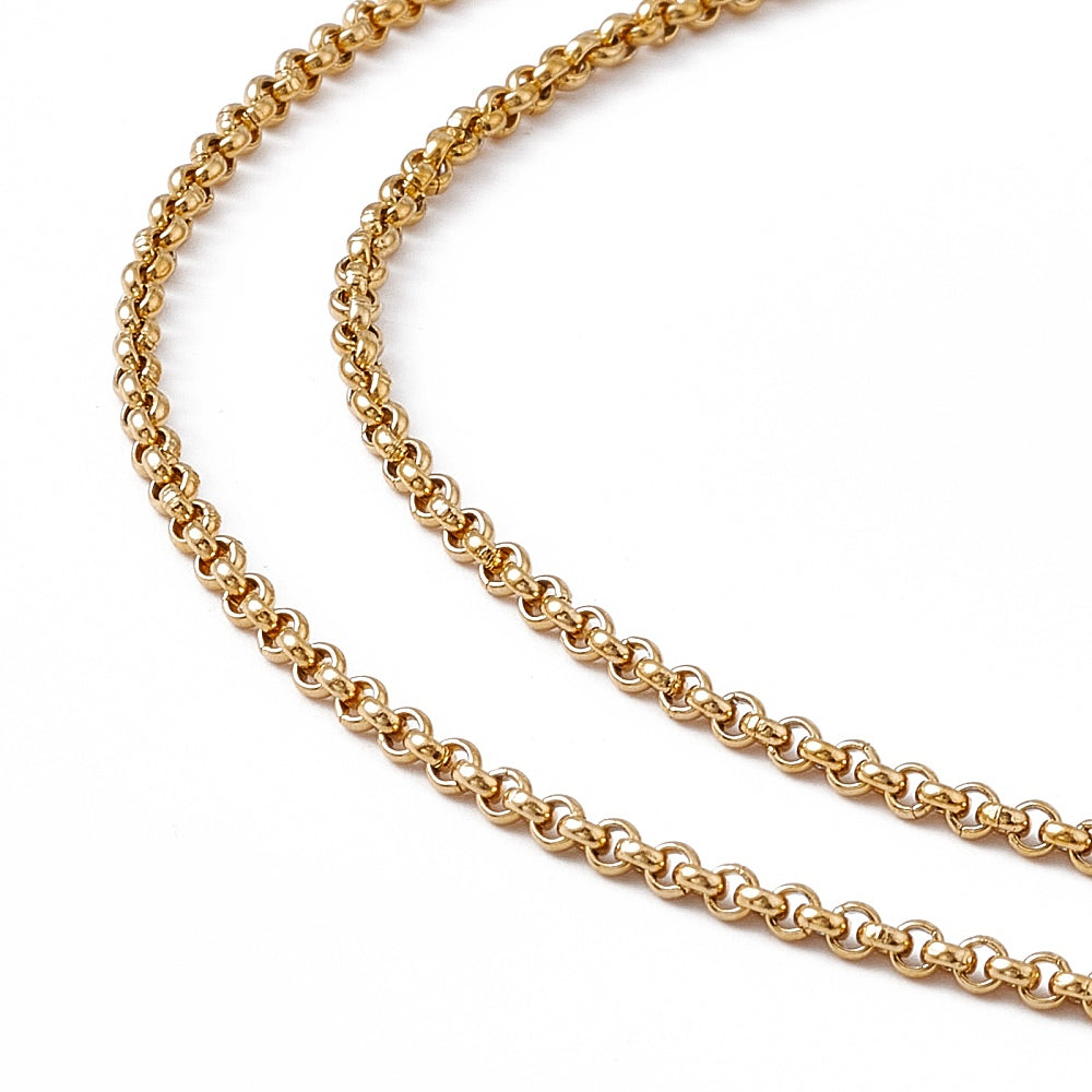 zoomed in sections of golden Rolo chain necklace over white background. 
