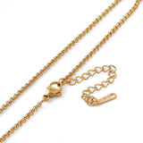 zoomed in sections golden Rolo chain necklace with lobster claw clasp and extender chain over white background. 