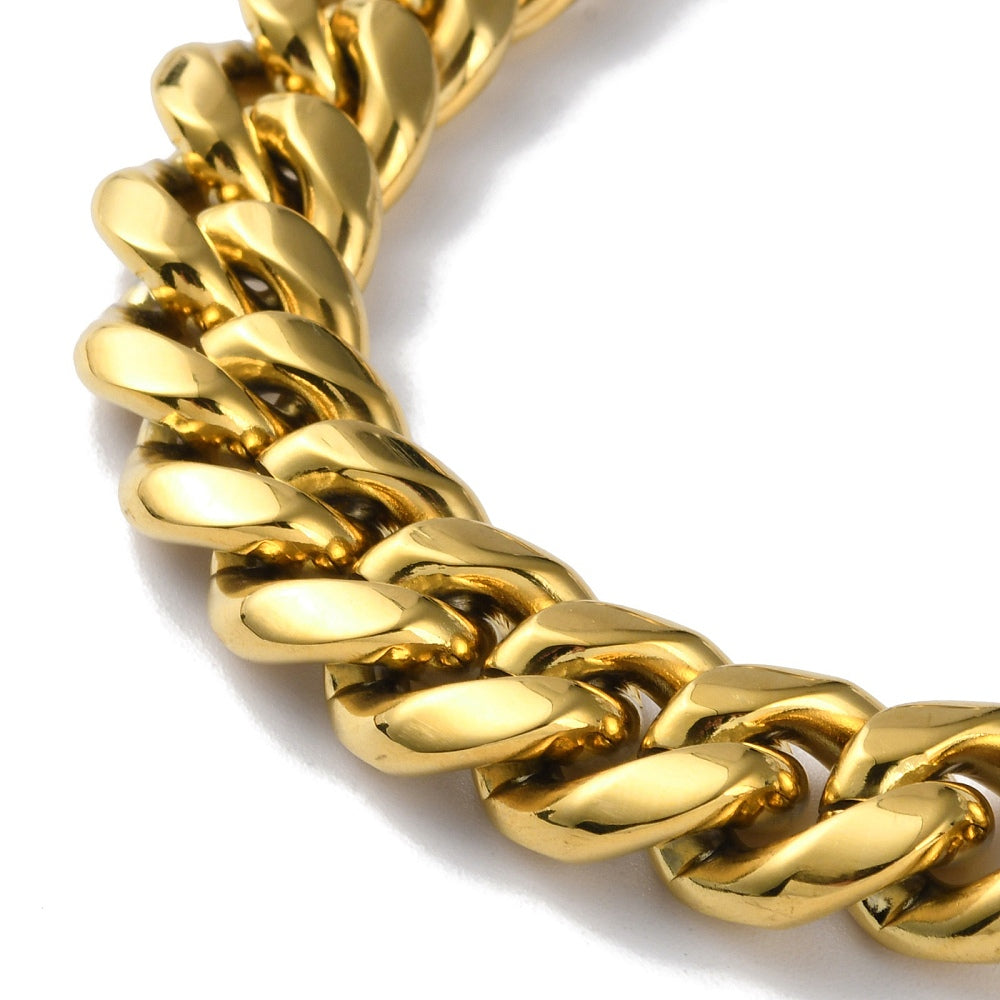 zoomed in section of golden extra large curb link chain on white background. 