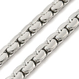 zoomed in section of silver tone flat box chain on white background. 