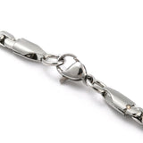 zoomed in section of silver tone flat box chain with lobster claw clasp on white background. 