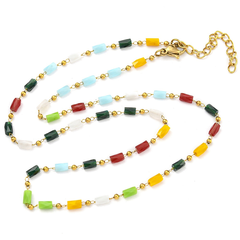 multi-colored glass column link chain necklace with golden lobster claw clasp and extender chain on white background. 