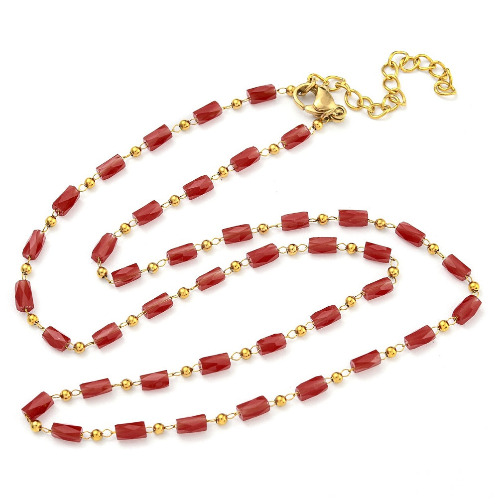 red glass column link chain necklace with  golden lobster claw clasp and extender chain on white background. 