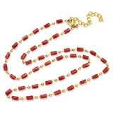 red glass column link chain necklace with  golden lobster claw clasp and extender chain on white background. 