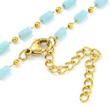 zoomed in sections of light blue glass column link chain necklace with golden lobster claw clasp and extender chain on white background. 
