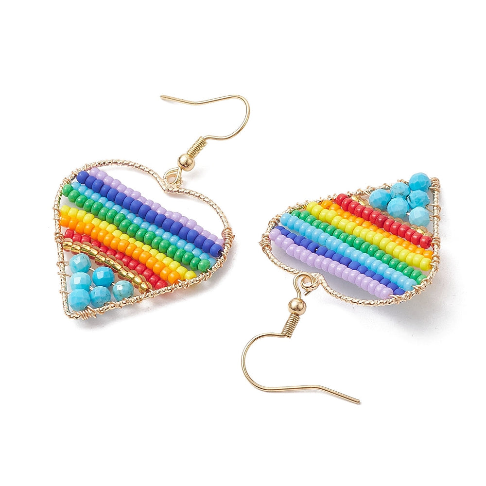 silver tone multicolor dyed magnesite and glass seed bead rainbow heart earrings with ear wires over white background. 