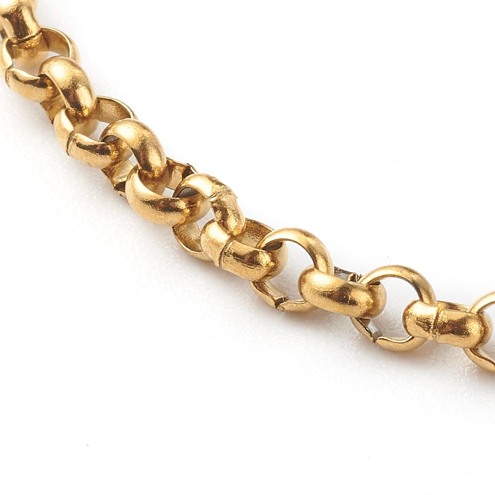 close-up of golden rolo chain over white background. 