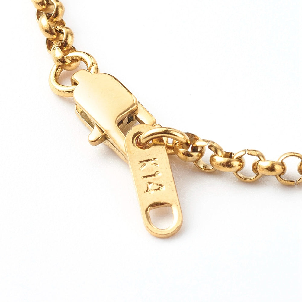 close-up of golden lobster claw clasp and extender tab on a rolo chain over white background. 