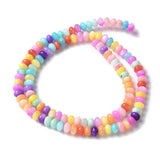 two strands of multi-color dyed shell rondelle beads in swirl design on white background. 