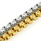 zoomed in sections of a golden and a silver toned Venetian chain side by side on a white background. 