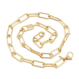 golden large round paperclip chain necklace with large lobster claw clasp in spiral pattern over white background. 