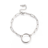 silver tone paperclip chain bracelet with ring focal lobster claw clasp and extender chain over white background. 
