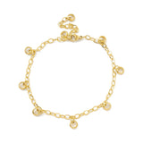 golden add-a-charm bracelet with nine evenly spaced, dangling, soldered jump rings, a lobster claw clasp and extender chain on white background. 