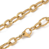 zoomed in sections of golden textured cable chain with lobster claw clasp on white background. 