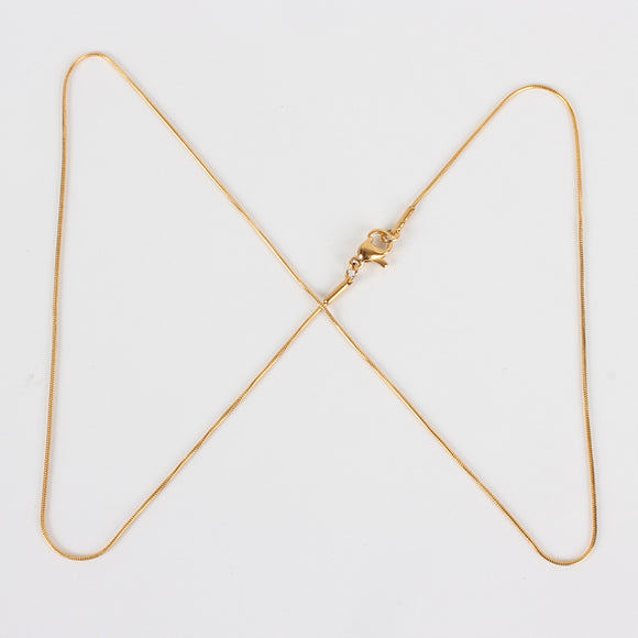 golden snake chain with lobster claw clasp on white background. 