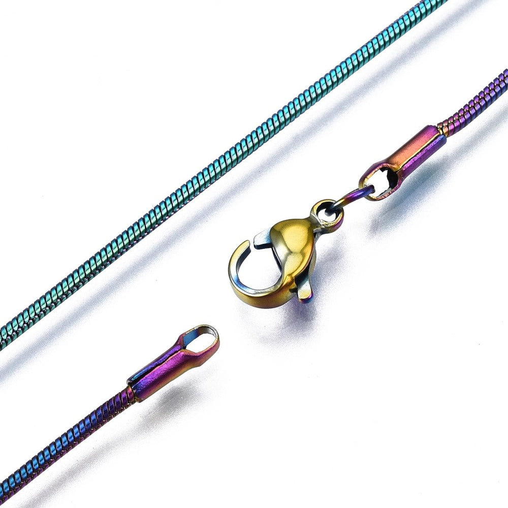 zoomed in sections of rainbow ion plated snake chain with lobster claw clasp on white background. 