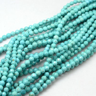 light blue turquoise dyed Howlite faceted round bead strands over white background. 
