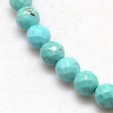 zoomed in section of light blue turquoise dyed Howlite faceted round bead strands over white background. 