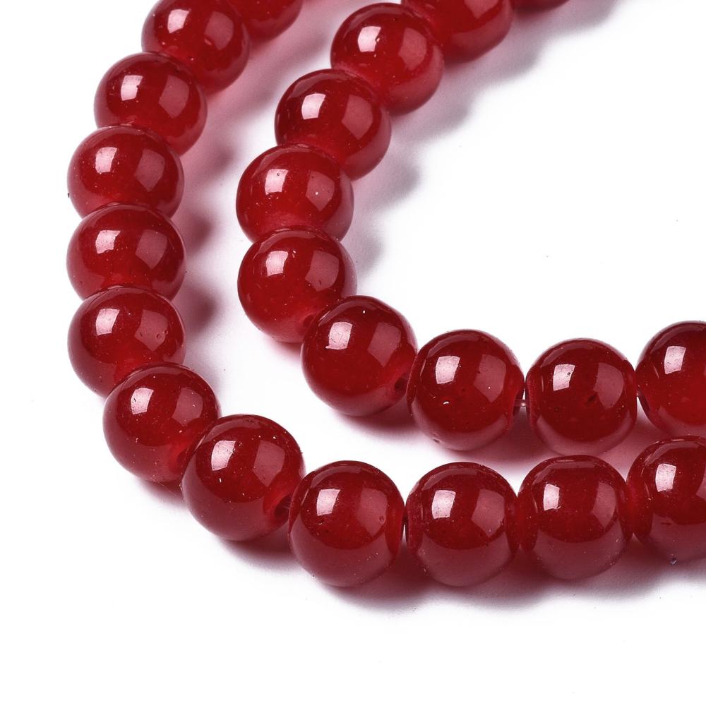 zoomed in section four red round glass bead strands over white background. 